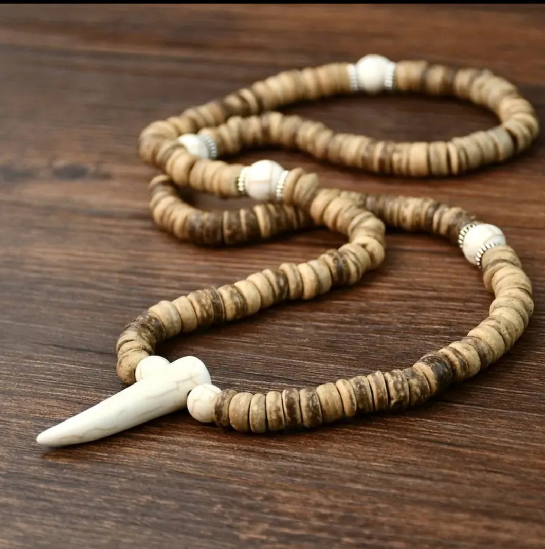 The elephant tooth necklace
